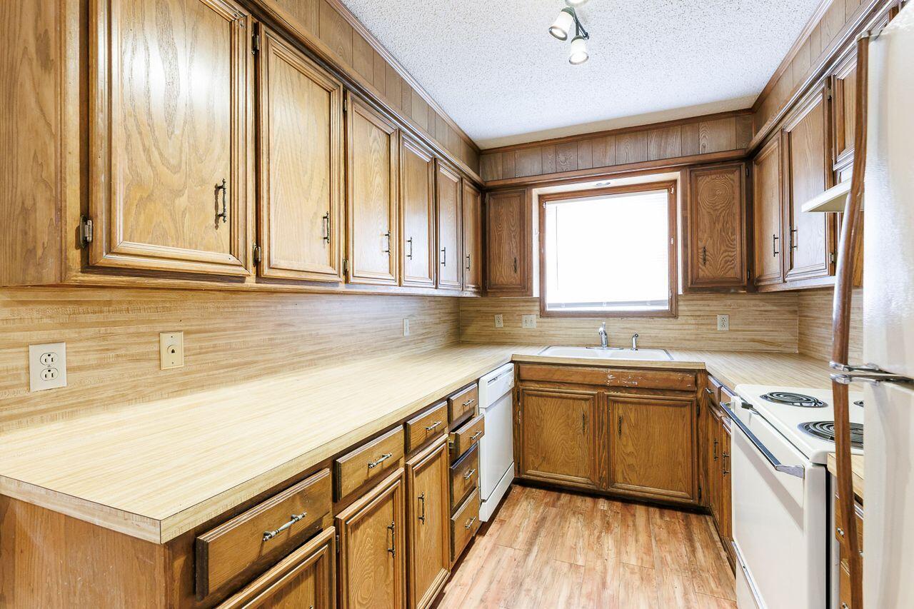 6411 York Drive, Unit B Lubbock, TX 79414 - Photo 12 of 28 a kitchen with stainless steel appliances sink cabinets and window