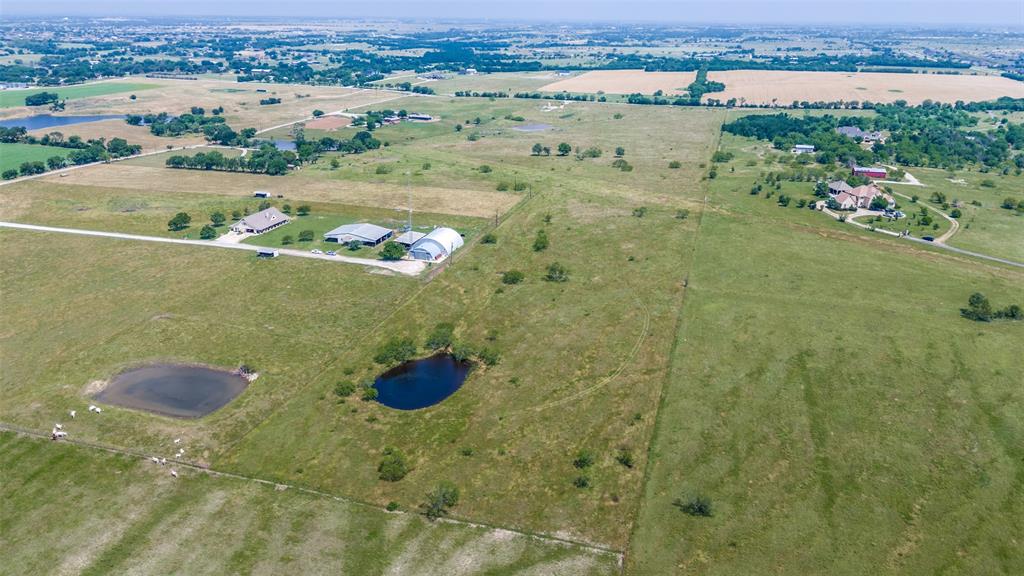 8650 Holder Road Justin, TX 76247 - Photo 1 of 1 an aerial view of a residential houses and outdoor space