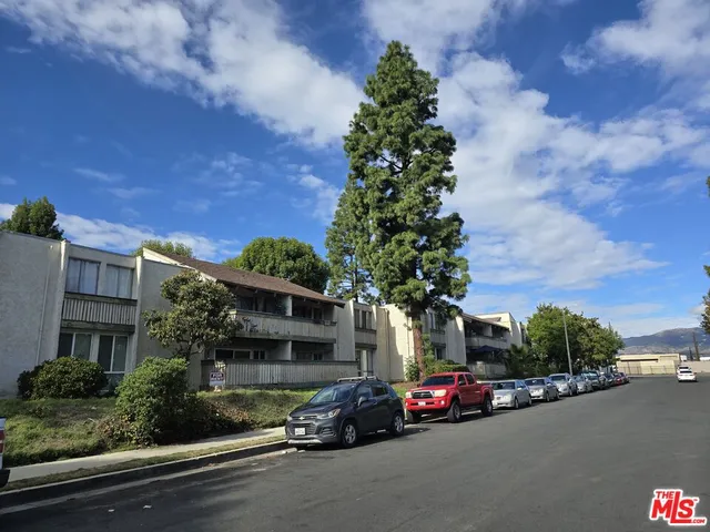 a view of a street with cars