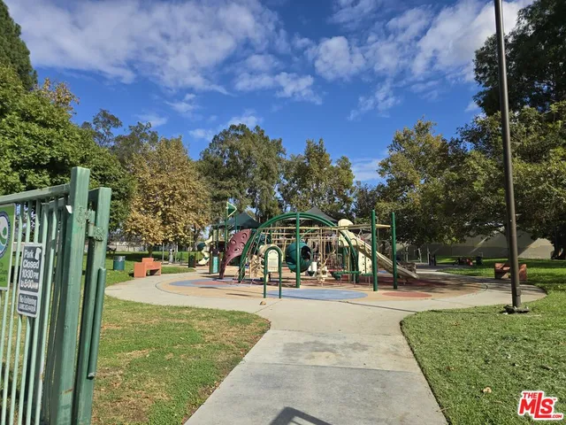 a view of a park with many windows
