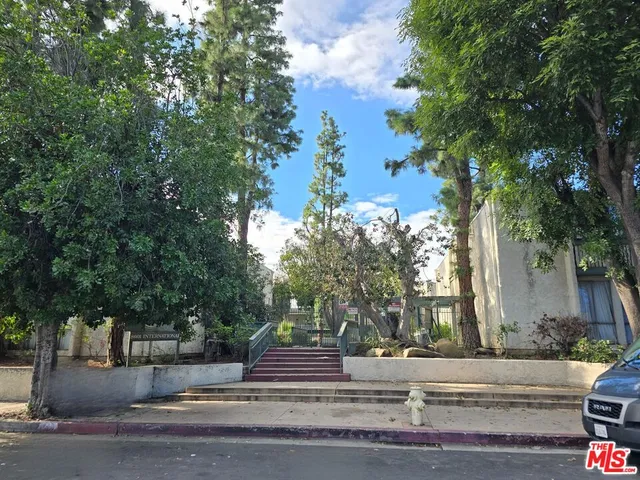 front view of a house with a tree