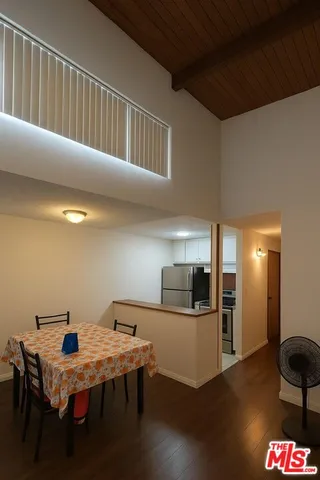 a kitchen with stainless steel appliances a refrigerator and a stove