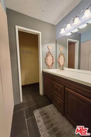 a bathroom with a toilet sink and shower