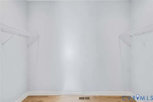 en empty room with closet and fan