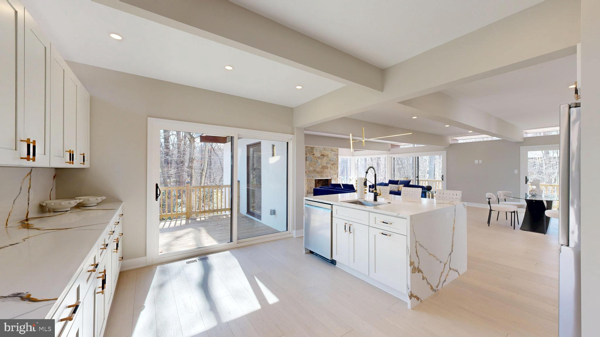 11101 Wedge Drive Reston, VA 20190 - Photo 13 of 55 a large white kitchen with a lot of counter space and a sink
