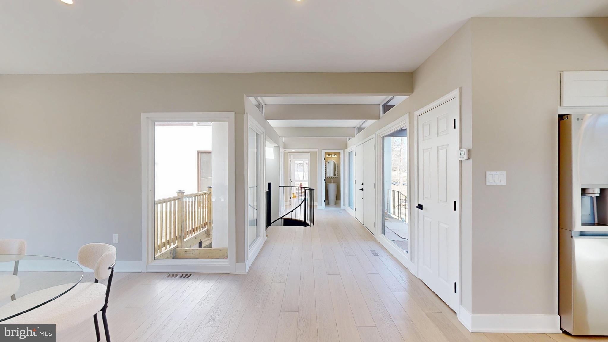 11101 Wedge Drive Reston, VA 20190 - Photo 17 of 55 a view of a room with wooden floor and windows