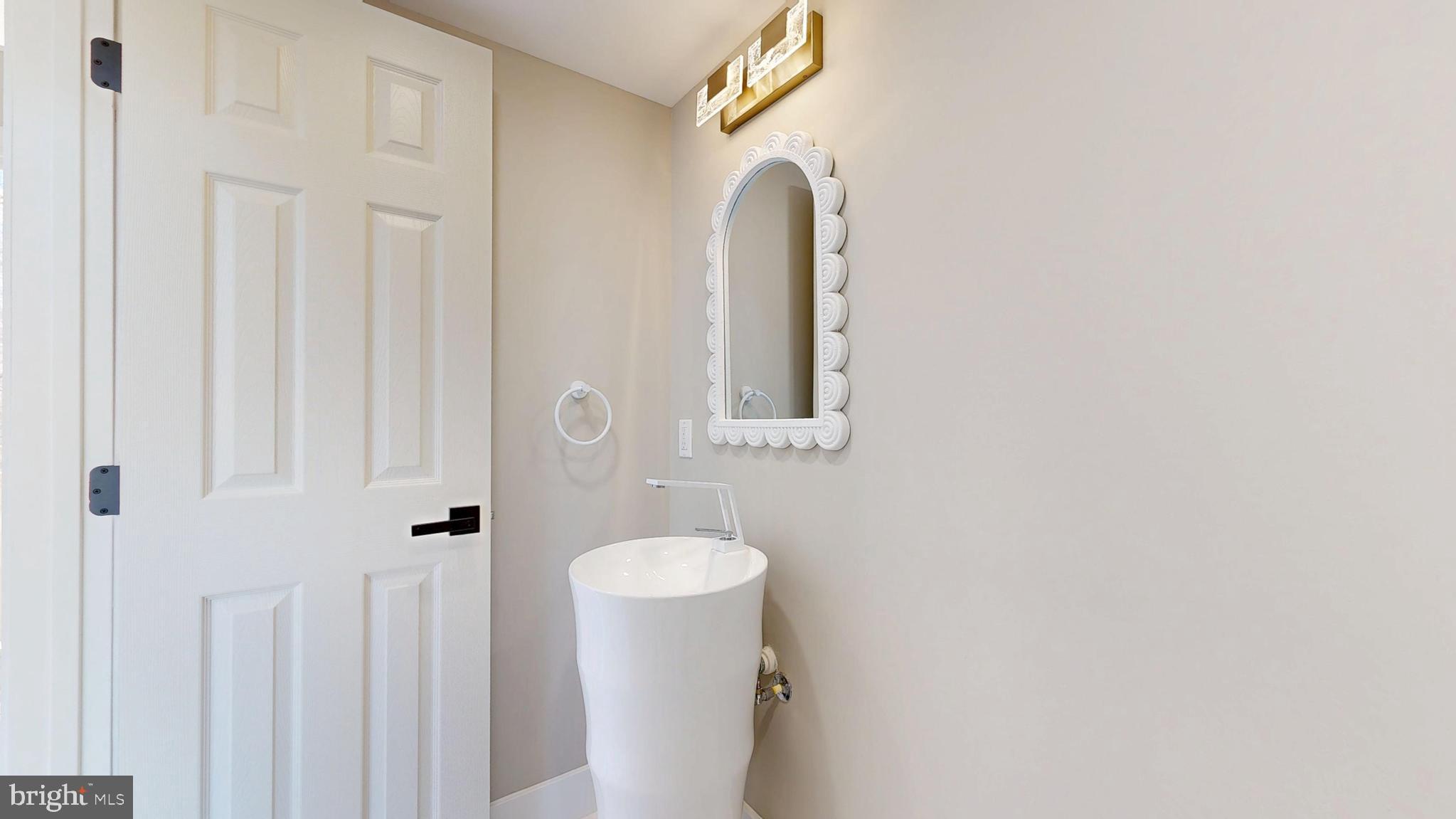 11101 Wedge Drive Reston, VA 20190 - Photo 19 of 55 a bathroom with a sink and mirror