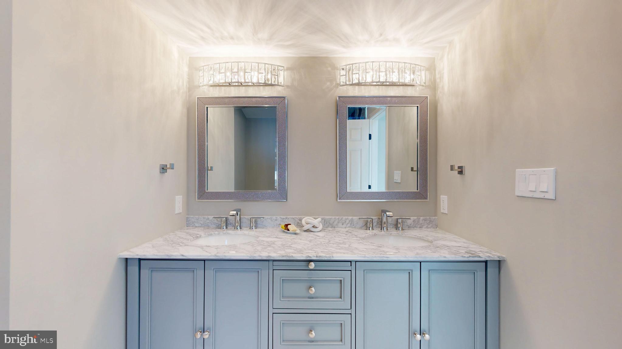 11101 Wedge Drive Reston, VA 20190 - Photo 29 of 55 a bathroom with a granite countertop sink and a mirror