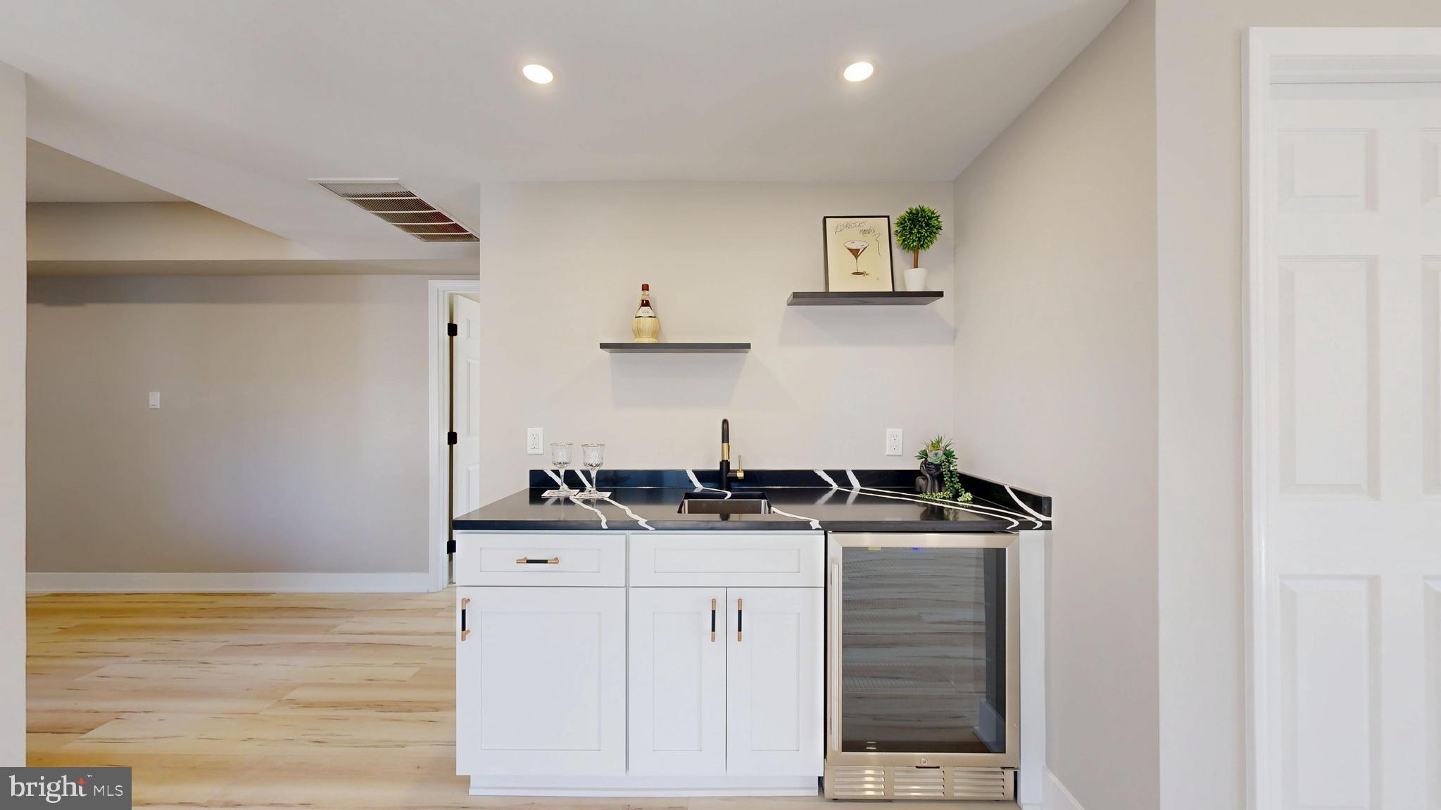 11101 Wedge Drive Reston, VA 20190 - Photo 34 of 55 a kitchen with stainless steel appliances granite countertop a stove and a sink