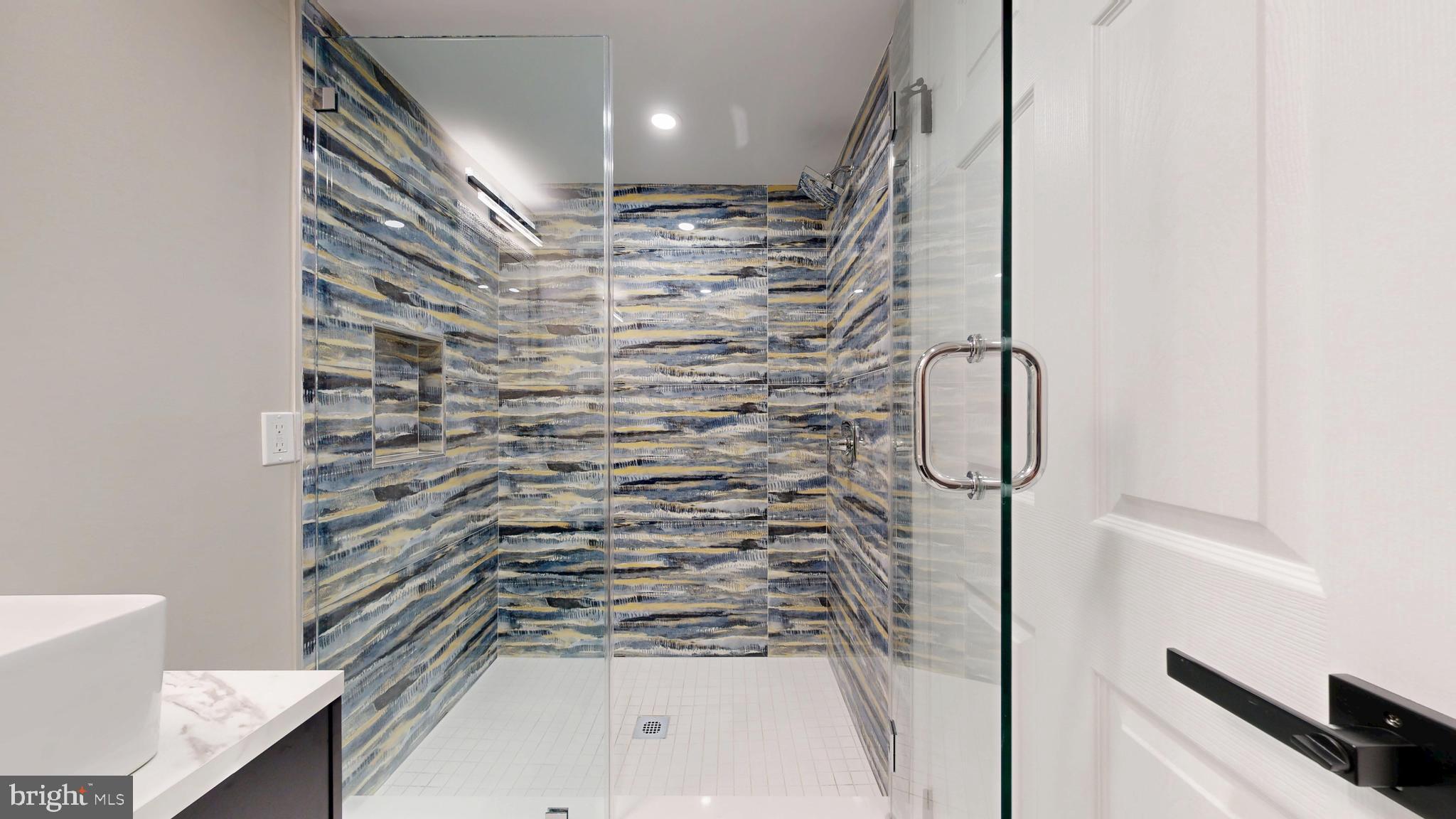 11101 Wedge Drive Reston, VA 20190 - Photo 42 of 55 a bathroom with a shower and a sink