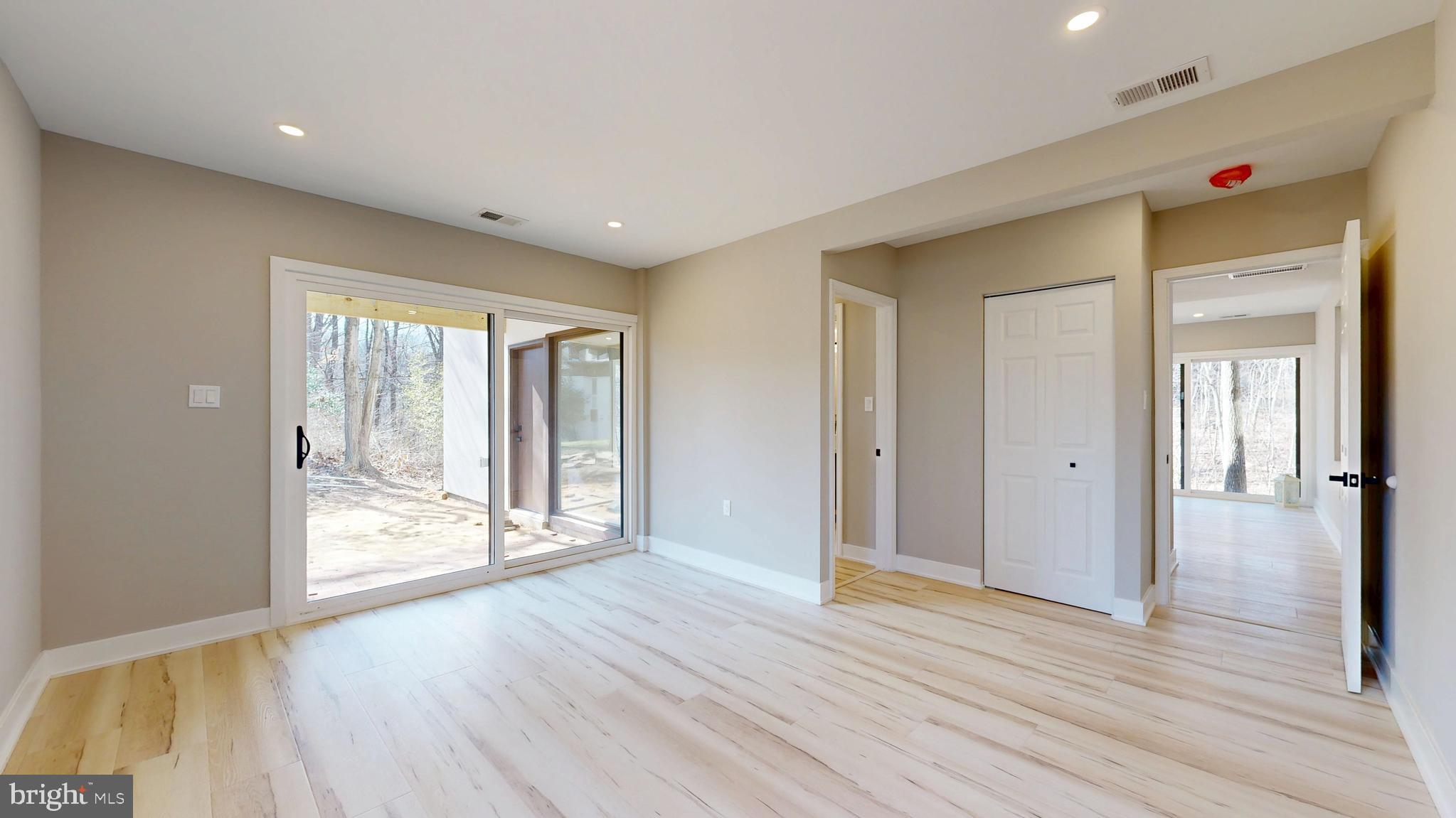 11101 Wedge Drive Reston, VA 20190 - Photo 43 of 55 a view of an empty room with wooden floor and a window