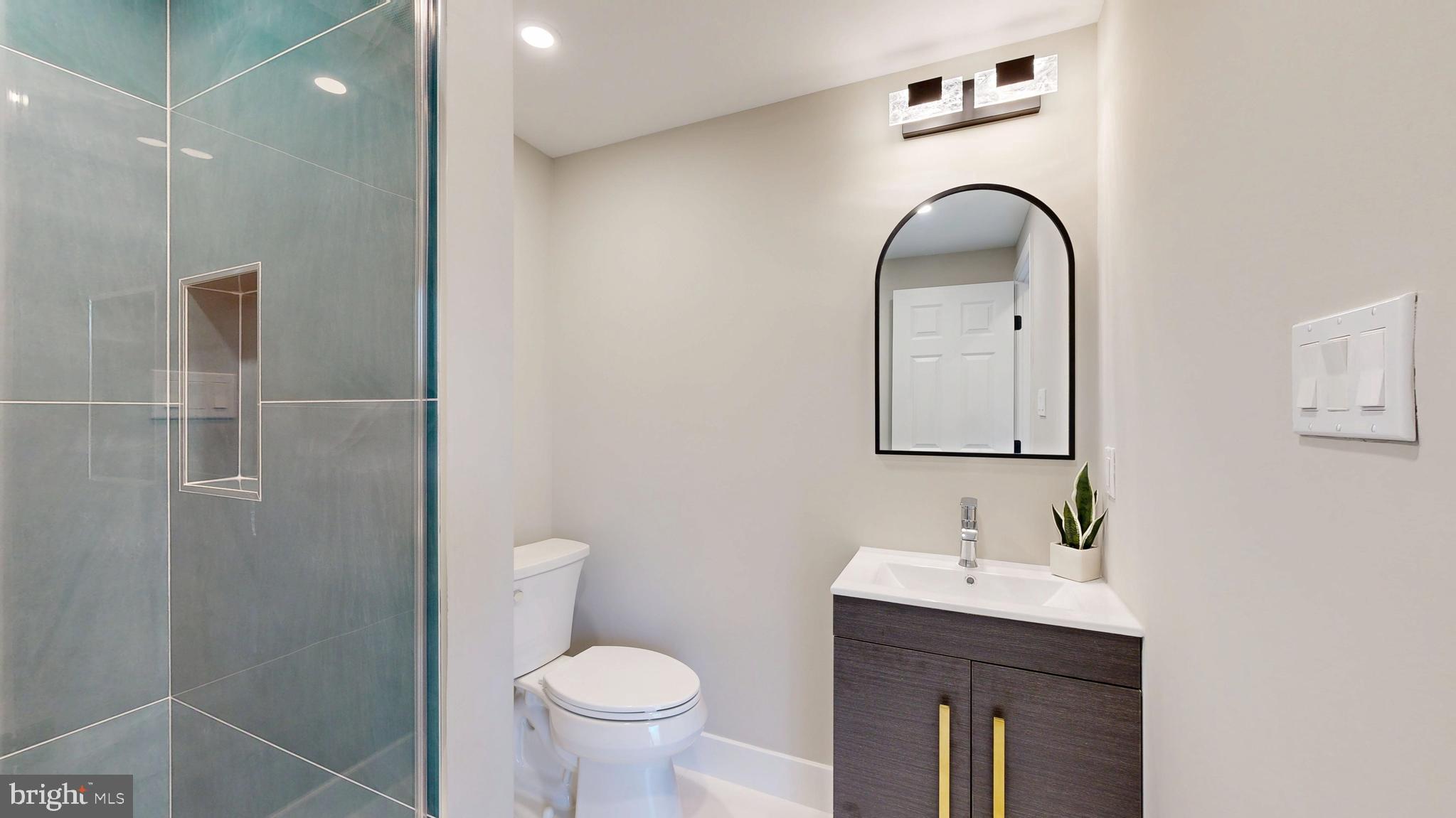 11101 Wedge Drive Reston, VA 20190 - Photo 46 of 55 a bathroom with a sink toilet and a mirror