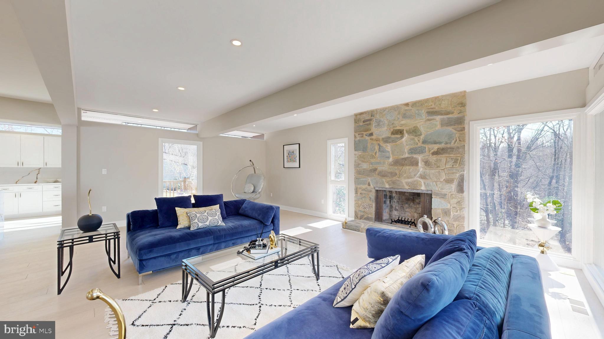 11101 Wedge Drive Reston, VA 20190 - Photo 8 of 55 a living room with furniture fireplace and a large window