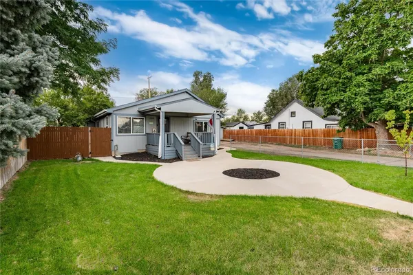 a table and chairs sitting in the grass