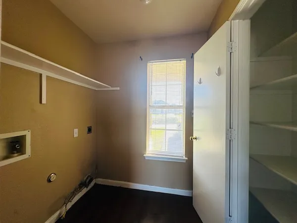 a view of room with window and gate