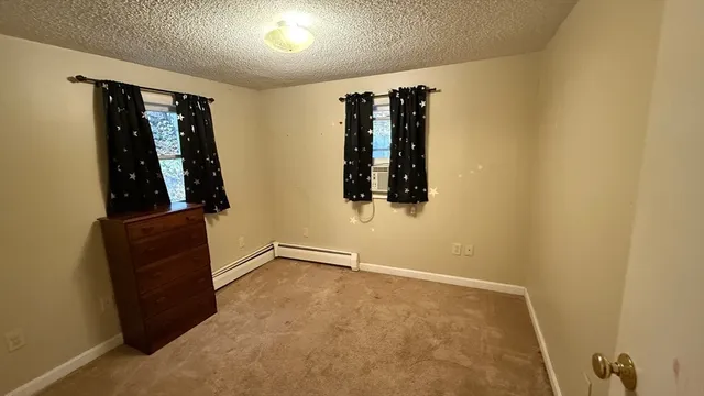 an entryway with a rug