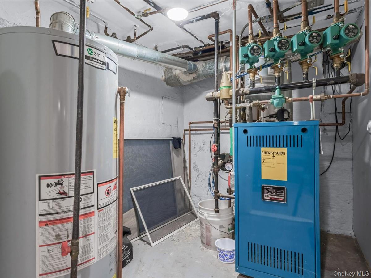 217-32 Corbett Road Queens, NY 11361 - Photo 23 of 25 Utilities with gas water heater and a heating unit