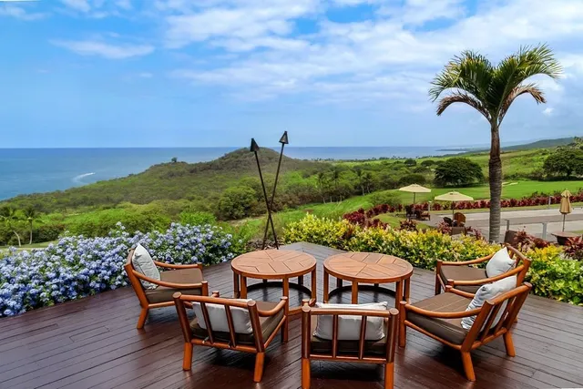 a outdoor living space with furniture and city view