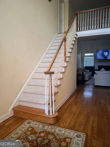 a view of entryway with wooden floor