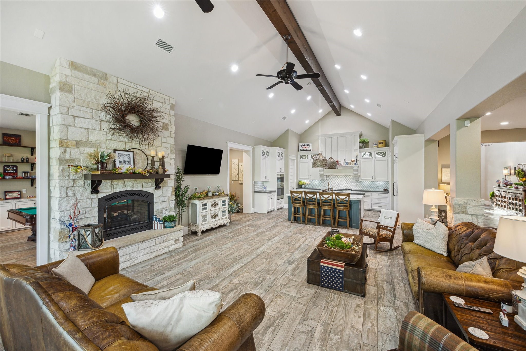 1255 Bronco Trail Angleton, TX 77515 - Photo 14 of 50 a living room with furniture a fireplace and a flat screen tv