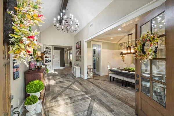 a lobby room with furniture and flowers