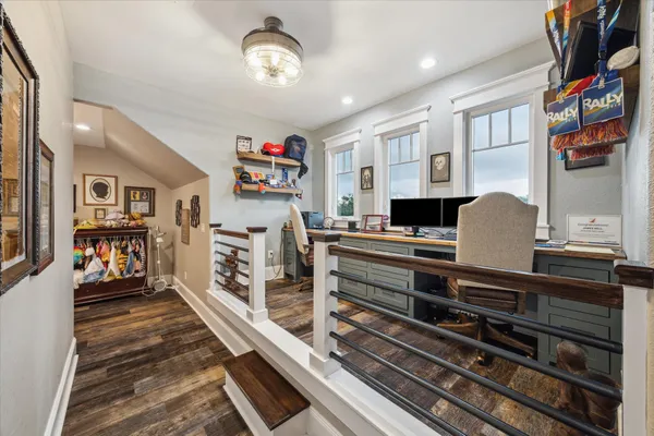 a kitchen with stainless steel appliances a stove a sink dishwasher and a dining table with cabinets