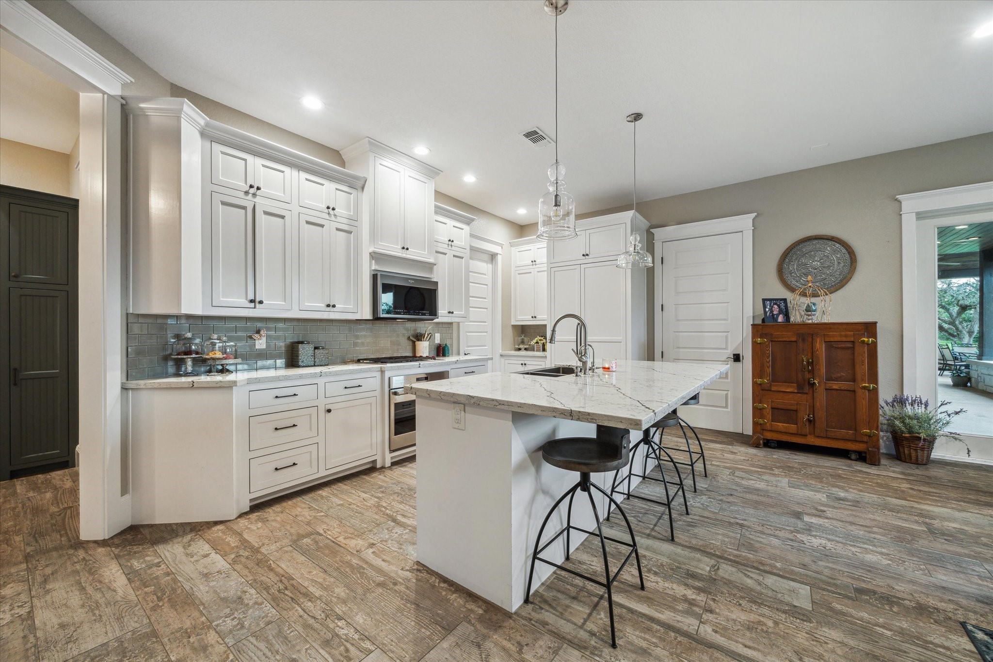 1255 Bronco Trail Angleton, TX 77515 - Photo 36 of 50 a large kitchen with a table and chairs