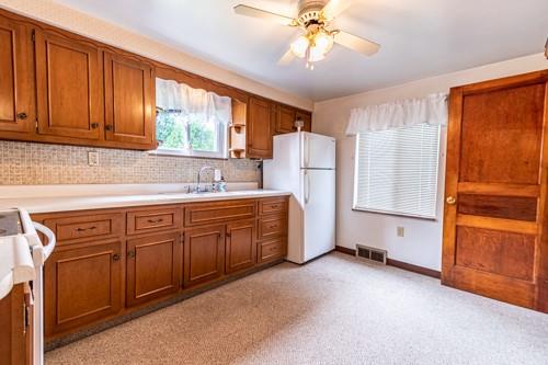 159 Craigdell Road Lower Burrell, PA 15068 - Photo 11 of 31 a kitchen with a refrigerator a stove a sink and cabinets