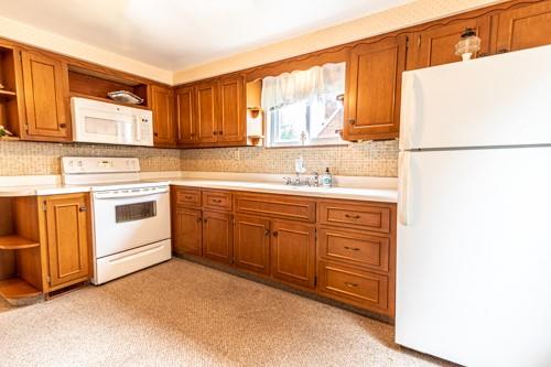 159 Craigdell Road Lower Burrell, PA 15068 - Photo 12 of 31 a kitchen with a sink stove and refrigerator