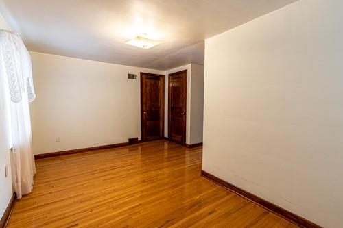 159 Craigdell Road Lower Burrell, PA 15068 - Photo 19 of 31 a view of an empty room with wooden floor