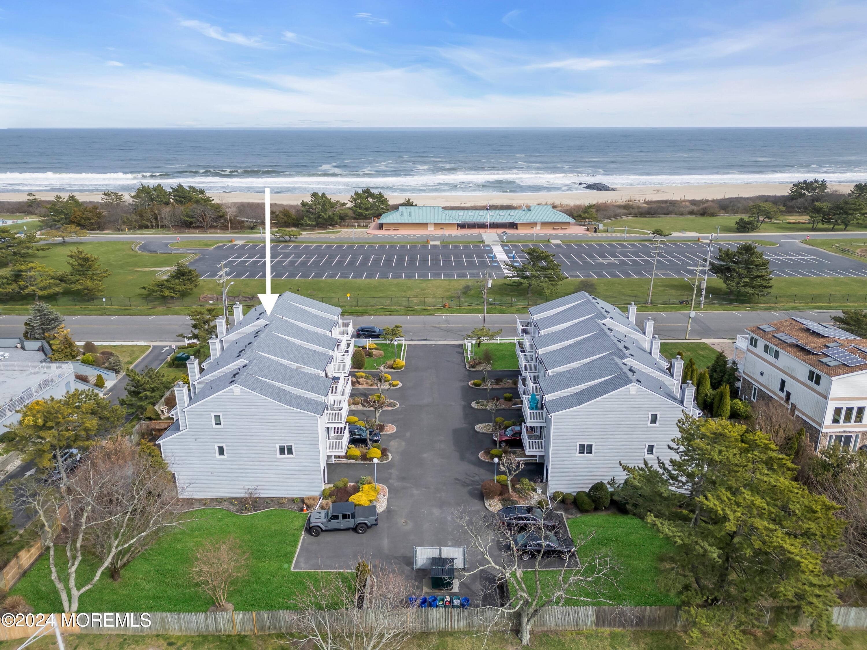 an aerial view of house with ocean view