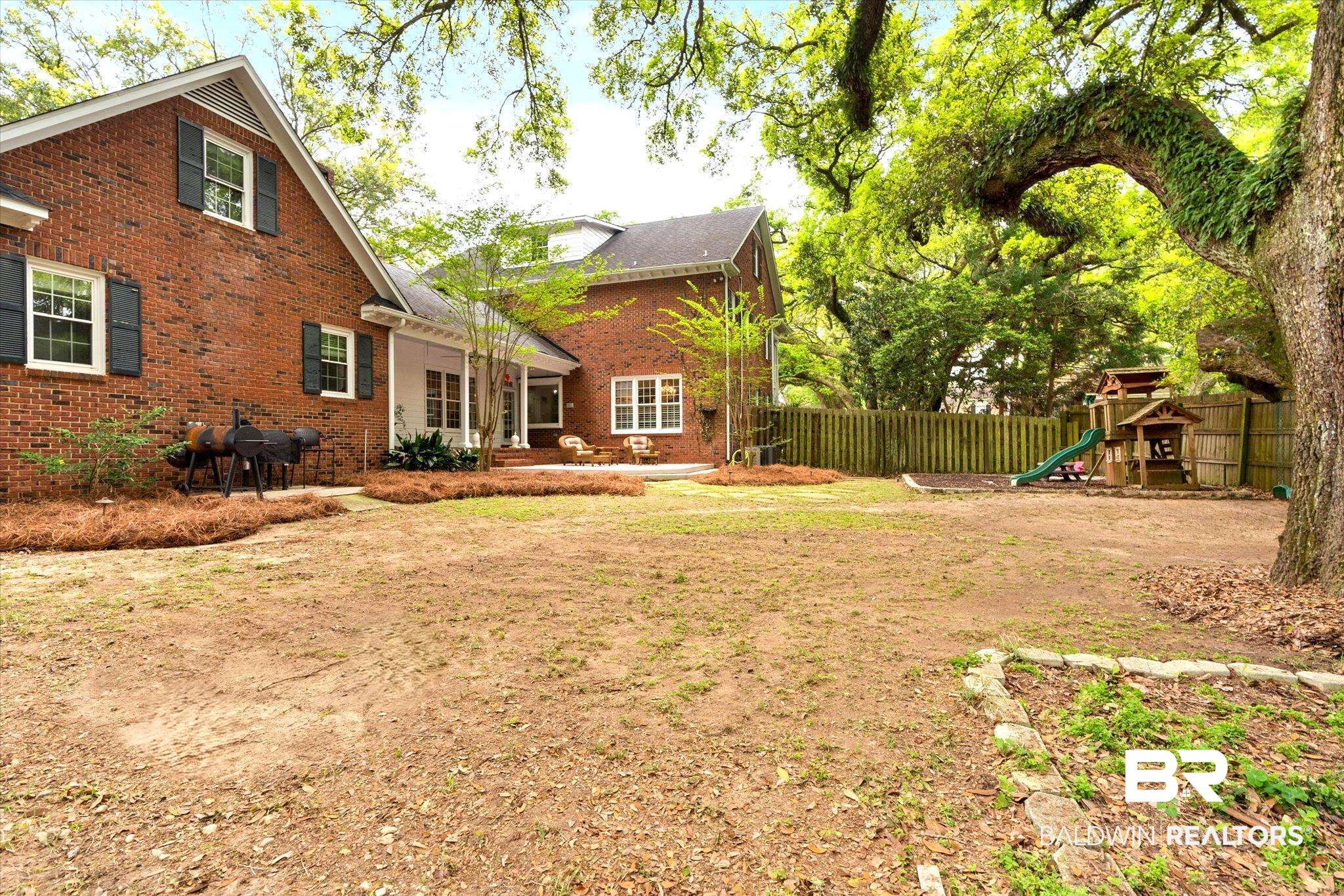 5324 Oak Bend Court Mobile, AL 36609 - Photo 38 of 49 View of yard featuring fence and a playground