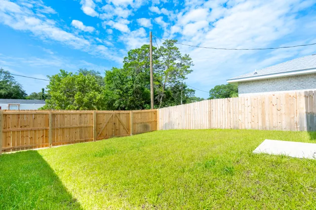 a view of a backyard with a small cabin
