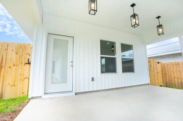 a view of a hallway with wooden shelves