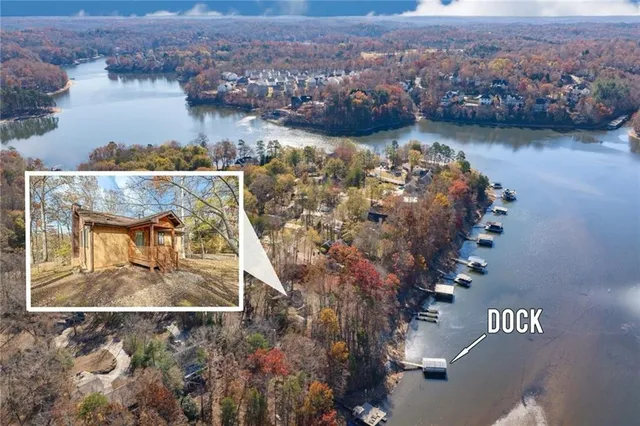 an aerial view of a house with a lake view