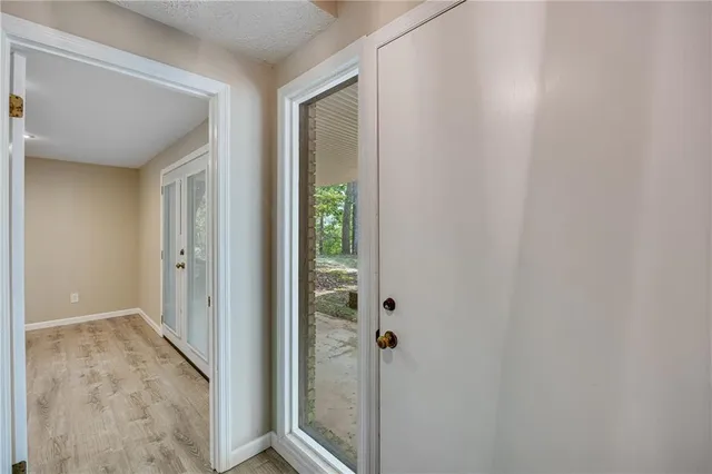 a view of a bathroom from a hallway