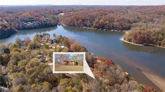 an aerial view of a house with a lake view