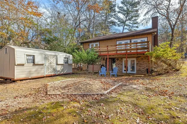 a view of a yard with large trees