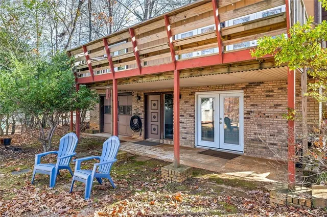 a view of a balcony with wooden floor and fence