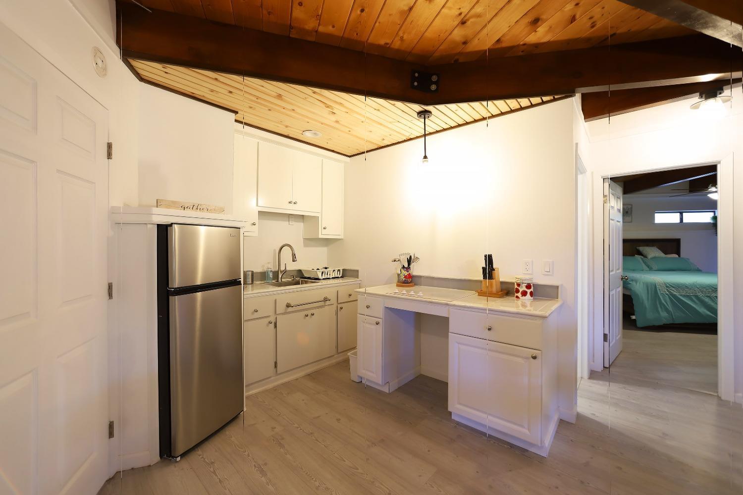 1870 Cable Road Camino, CA 95709 - Photo 35 of 36 a kitchen with a sink a refrigerator and cabinets