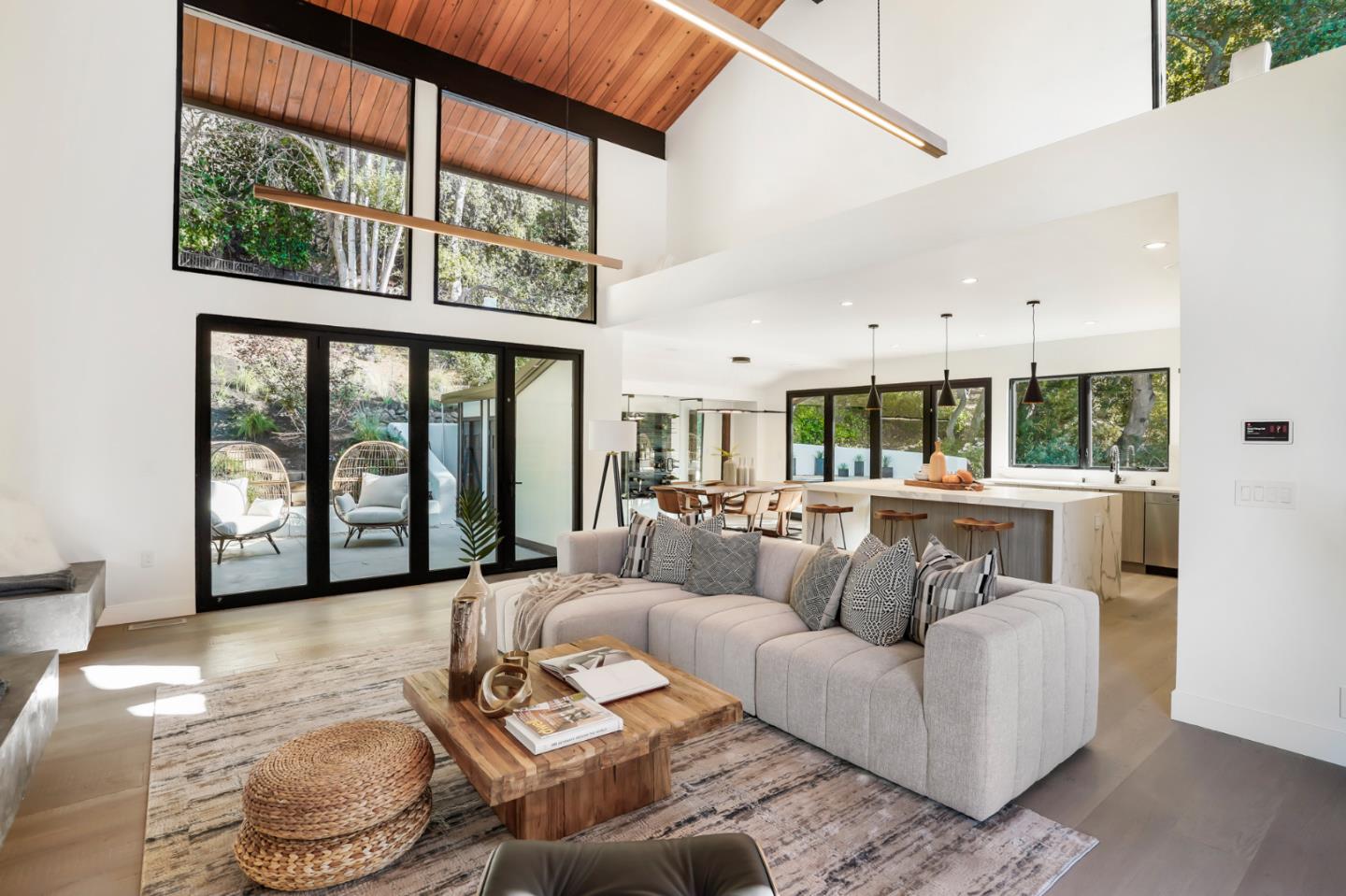 375 Walsh Road Atherton, CA 94027 - Photo 3 of 7 a living room with furniture and large windows