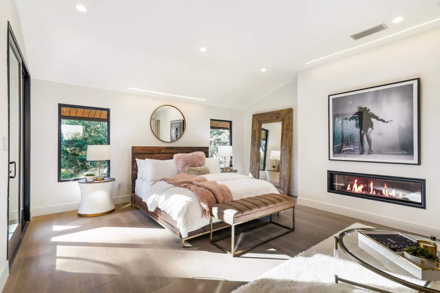 375 Walsh Road Atherton, CA 94027 - Photo 4 of 7 a bedroom with a large bed and a painting on the wall