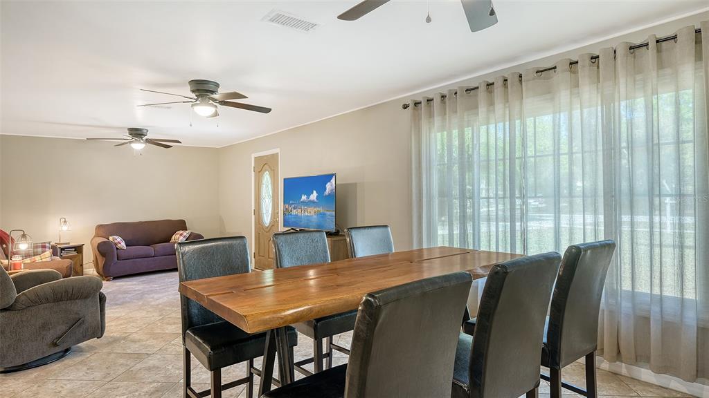 3818 Gocio Rd Extention Sarasota, FL 34235 - Photo 11 of 65 a view of a dining room with furniture and window