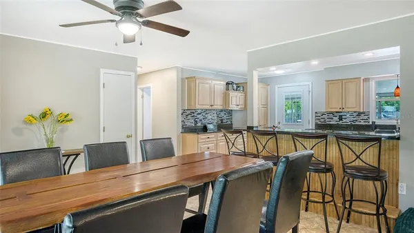 a kitchen with stainless steel appliances granite countertop a sink and a stove