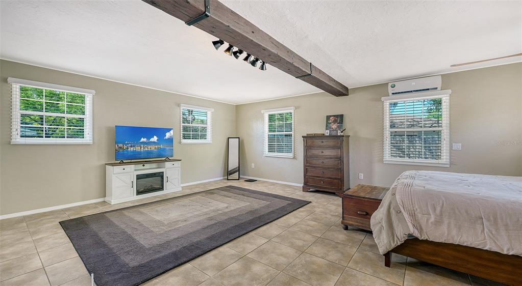 3818 Gocio Rd Extention Sarasota, FL 34235 - Photo 20 of 65 a bedroom with furniture and a window