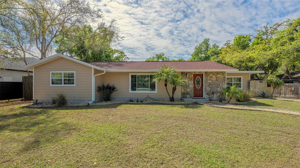 3818 Gocio Rd Extention Sarasota, FL 34235 - Photo 2 of 65 a front view of a house with a garden