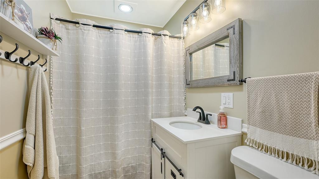 3818 Gocio Rd Extention Sarasota, FL 34235 - Photo 25 of 65 a bathroom with a sink a mirror a vanity and a shower