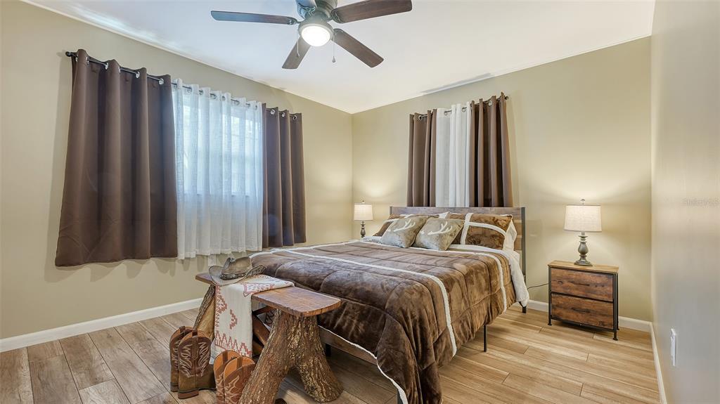 3818 Gocio Rd Extention Sarasota, FL 34235 - Photo 26 of 65 a bedroom with a bed and a mirror