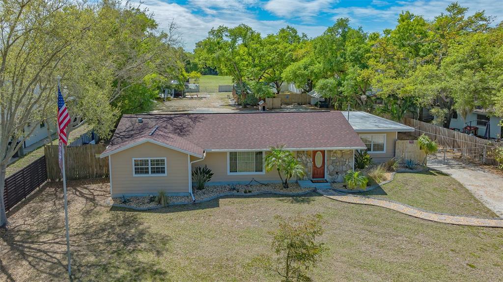 3818 Gocio Rd Extention Sarasota, FL 34235 - Photo 3 of 65 front view of a house with a yard
