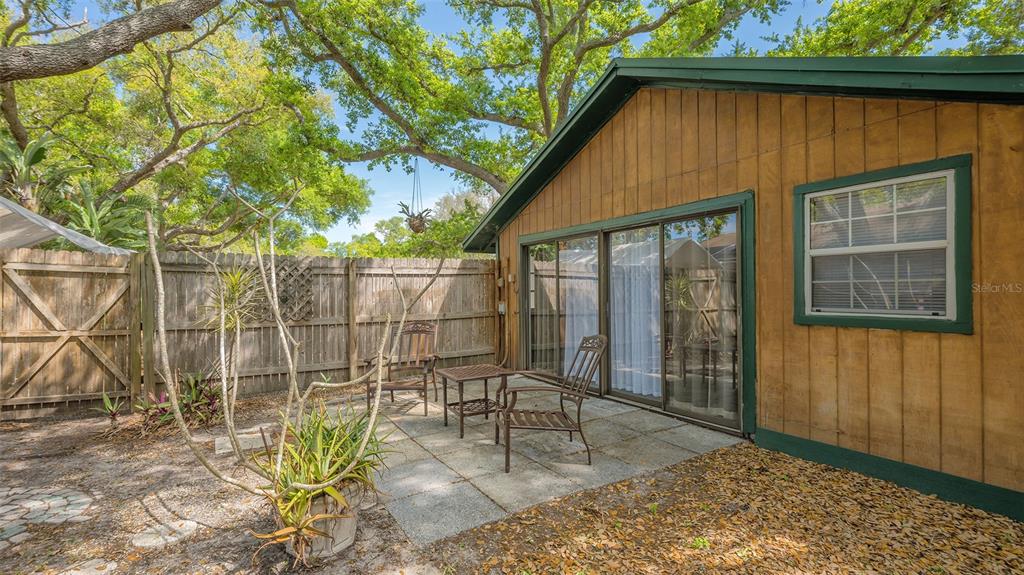 3818 Gocio Rd Extention Sarasota, FL 34235 - Photo 36 of 65 a patio with table and chairs and potted plants
